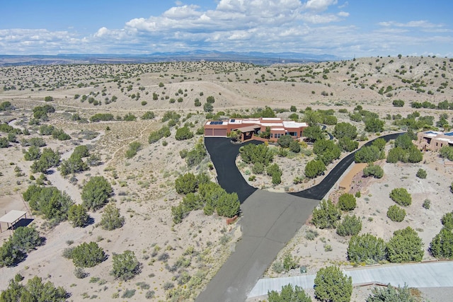 birds eye view of property featuring view of desert