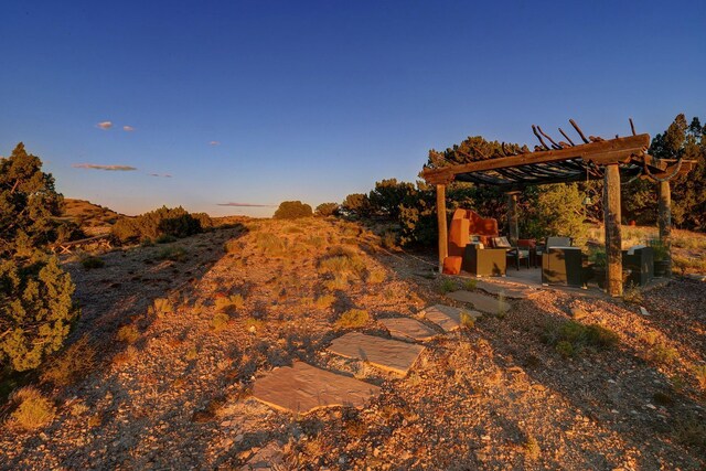 7 Calle Cholla, Placitas, NM 87043 - view of yard featuring a pergola, an outdoor hangout area, and a patio area