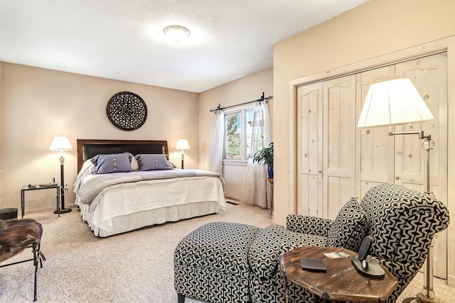 bedroom with carpet and a closet