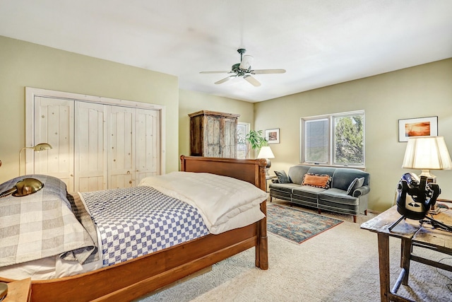 carpeted bedroom with a closet and ceiling fan