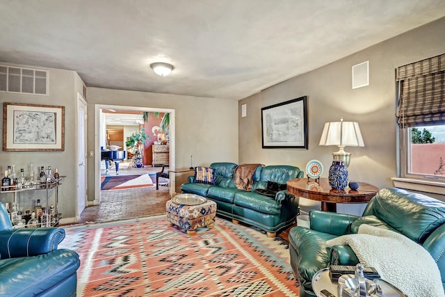 living room with visible vents and baseboards