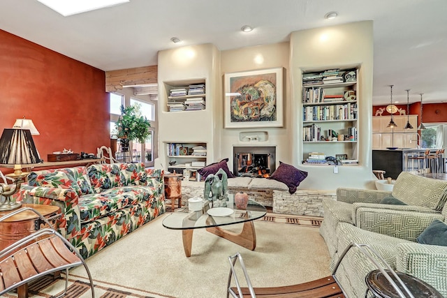 carpeted living area featuring a fireplace