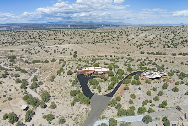 bird's eye view featuring a mountain view and a desert view