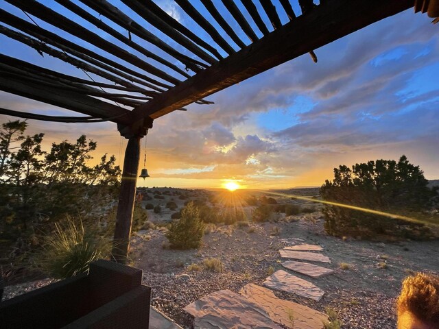 7 Calle Cholla, Placitas, NM 87043 - patio terrace at dusk with a pergola