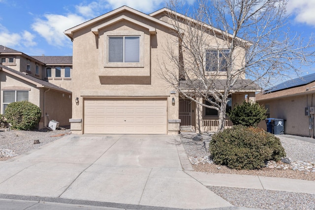 7805 Angel Peak Rd NW, Albuquerque, NM 87114 - view of front of home featuring a garage, concrete driveway, and stucco siding