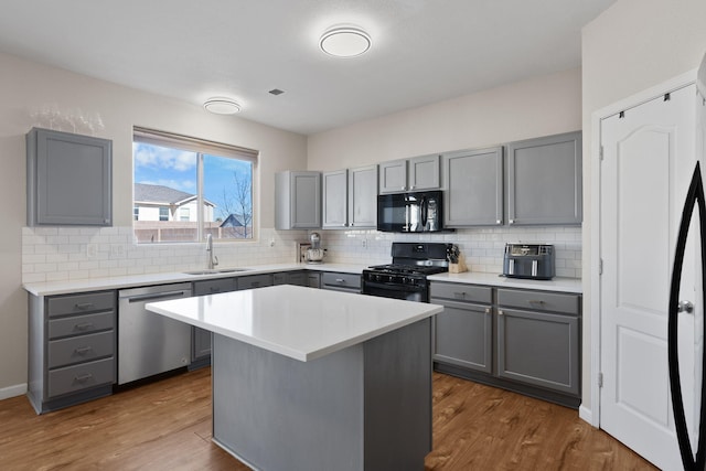 kitchen featuring black appliances and gray cabinetry