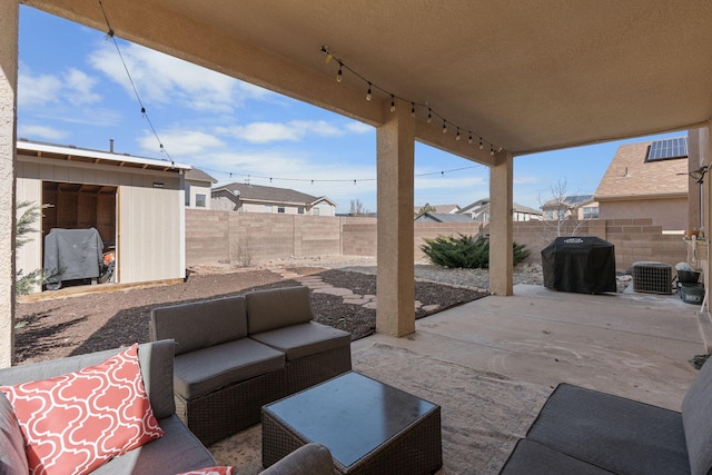 view of patio with a fenced backyard, a grill, and an outdoor hangout area