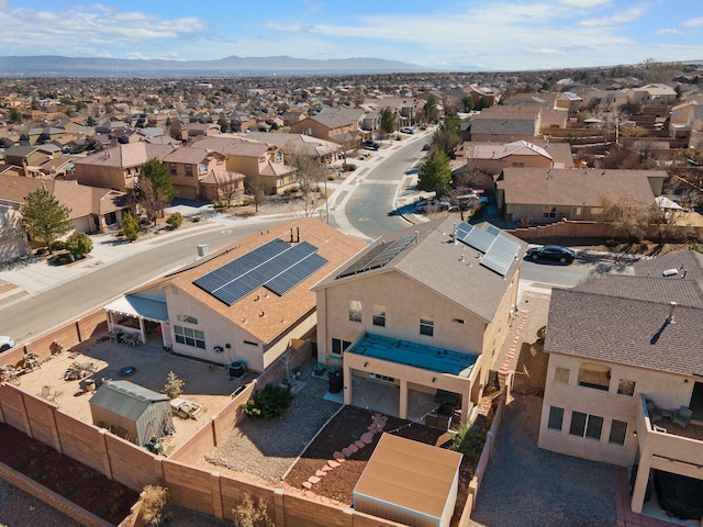 drone / aerial view with a residential view and a mountain view