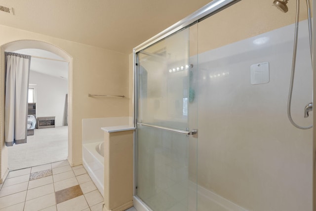 full bath featuring visible vents, a stall shower, tile patterned flooring, and a bath