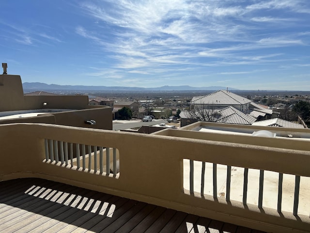 wooden deck featuring a mountain view