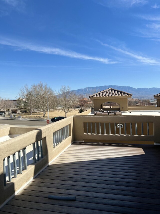 wooden terrace featuring a mountain view