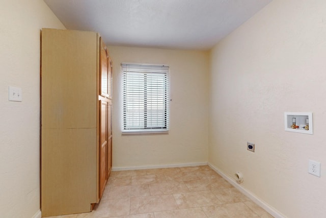 laundry room featuring laundry area, light tile patterned floors, baseboards, hookup for a washing machine, and electric dryer hookup