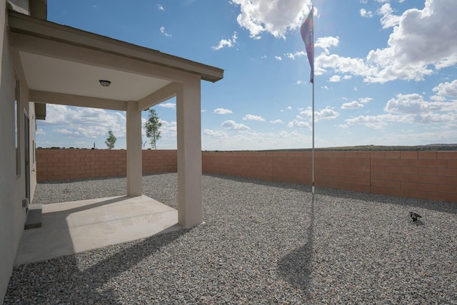 view of yard with a patio and a fenced backyard