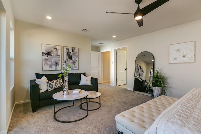 carpeted living area with baseboards, visible vents, and recessed lighting