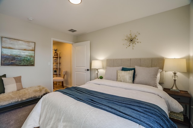 bedroom featuring visible vents and carpet flooring