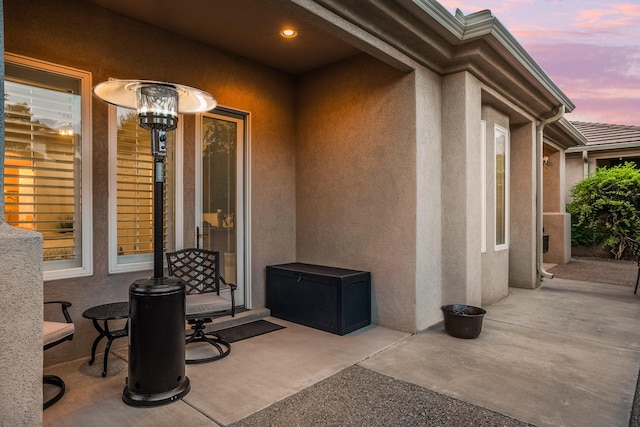 view of patio terrace at dusk