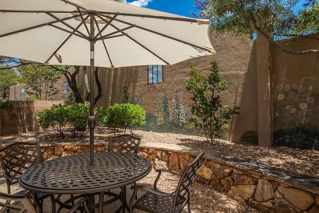 view of patio / terrace featuring outdoor dining space and fence