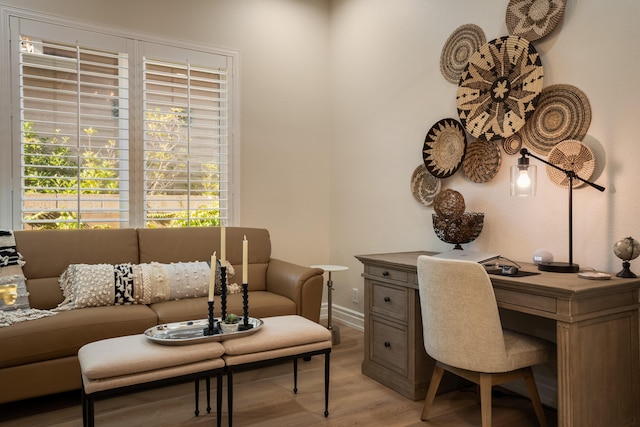 home office featuring light wood-style floors and baseboards