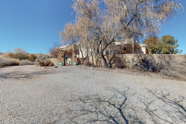 southwest-style home with fence