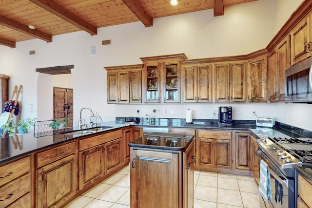 kitchen featuring a sink, light tile patterned floors, wood ceiling, and stainless steel appliances