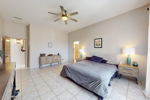 bedroom with light tile patterned floors, a ceiling fan, and visible vents