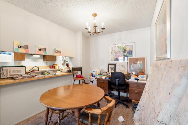 home office with carpet flooring, a notable chandelier, a textured ceiling, and baseboards