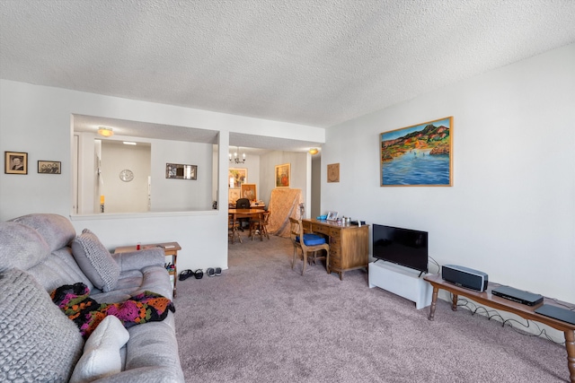 living area with carpet flooring and a textured ceiling