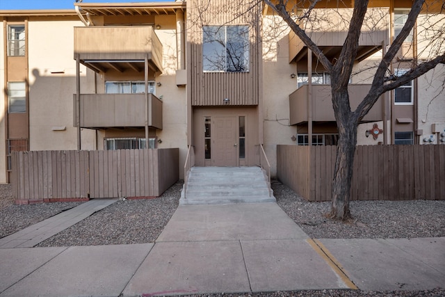 view of property with fence