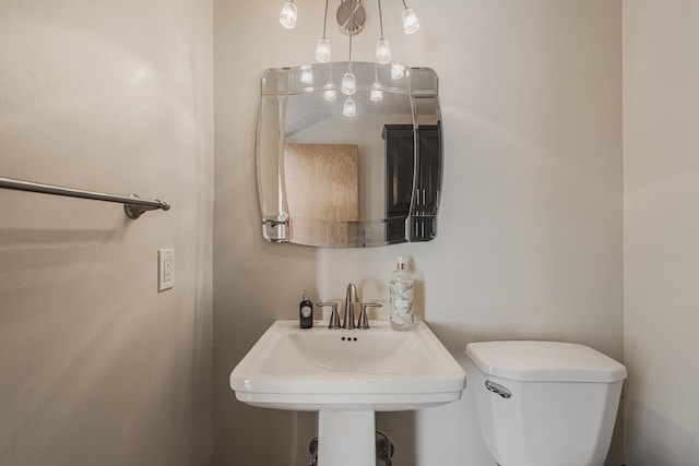 bathroom featuring toilet and a sink