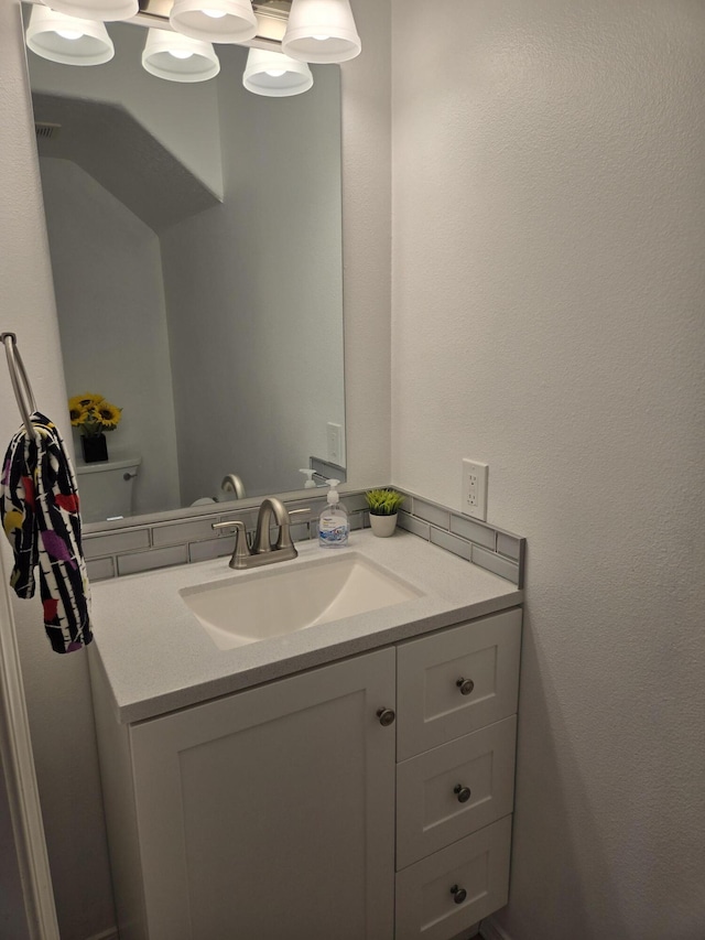 bathroom with visible vents and vanity