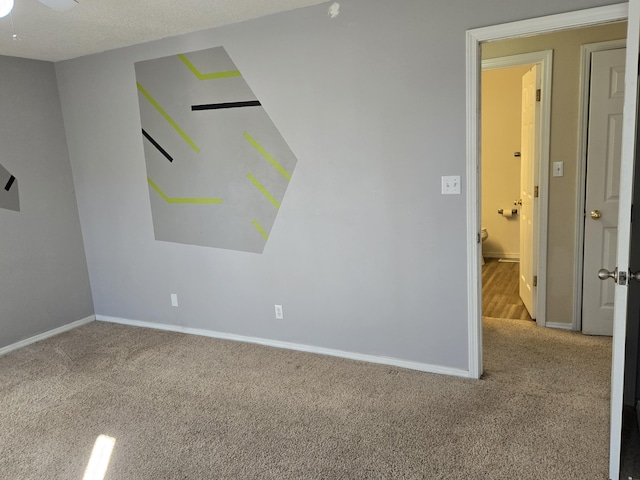 interior space with ceiling fan and baseboards