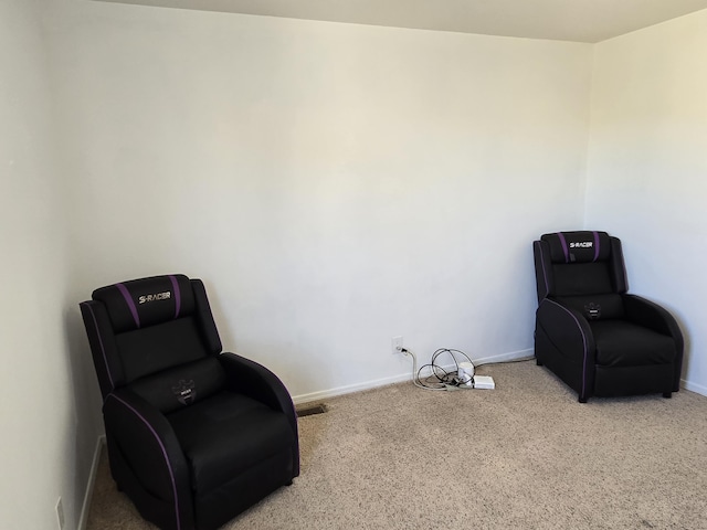 living area featuring baseboards