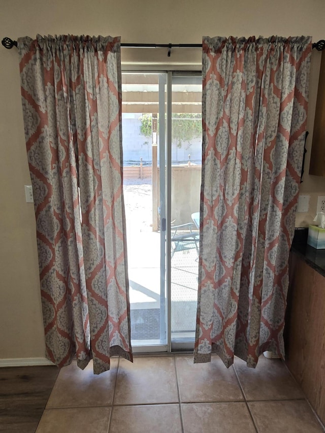 doorway featuring tile patterned floors