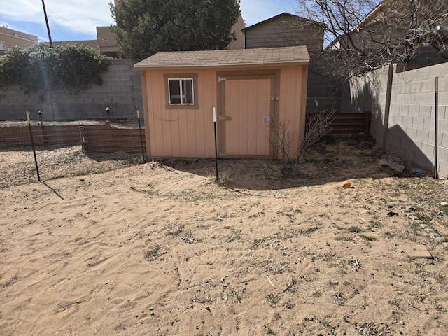 view of shed with a fenced backyard