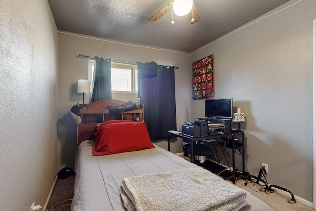 bedroom featuring a ceiling fan and a textured wall