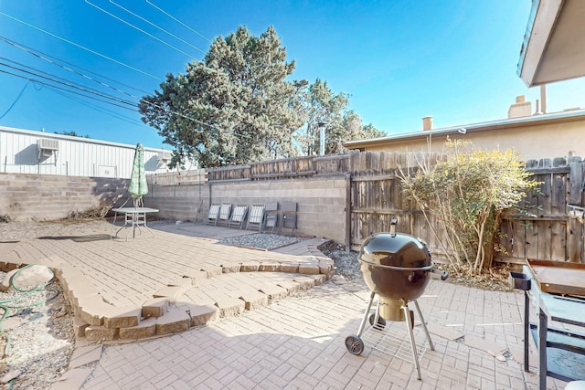 view of patio / terrace featuring a fenced backyard and area for grilling