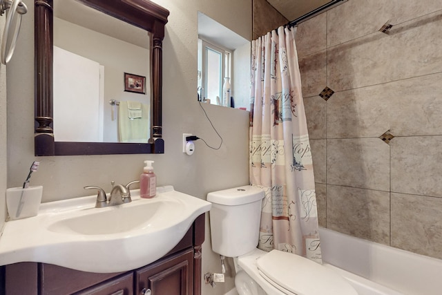 full bath with shower / bath combo with shower curtain, vanity, and toilet