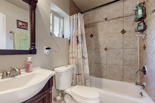 bathroom with toilet, shower / bath combination with curtain, and vanity