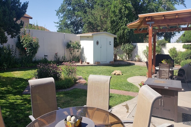 view of yard featuring a patio, a fenced backyard, an outbuilding, a storage unit, and outdoor dining space