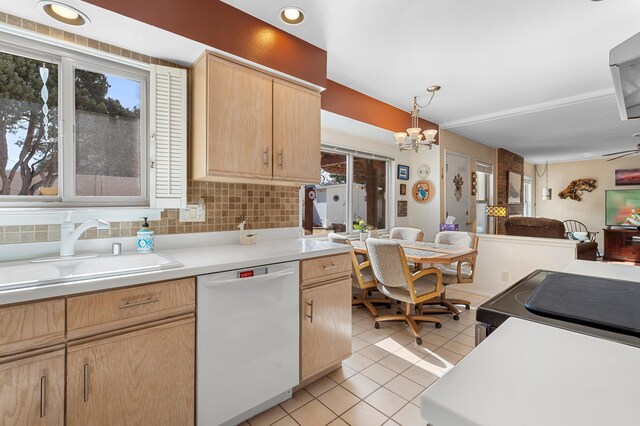 kitchen featuring light tile patterned floors, light brown cabinets, a sink, open floor plan, and dishwasher