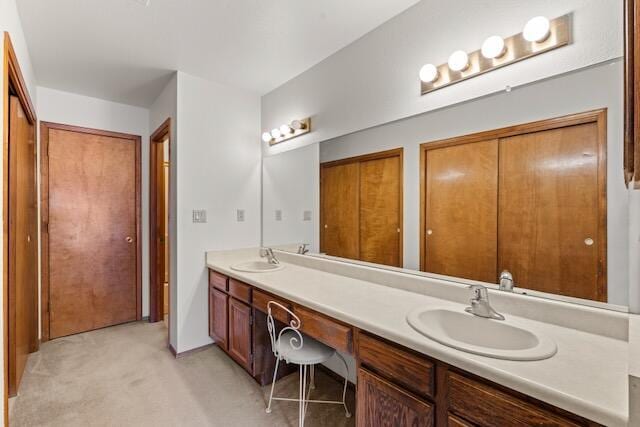 full bathroom featuring double vanity and a sink