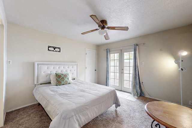 bedroom featuring light carpet, ceiling fan, access to exterior, a textured ceiling, and french doors