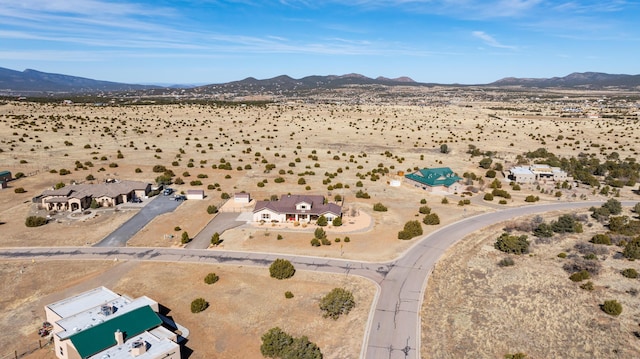 drone / aerial view with a mountain view and a desert view