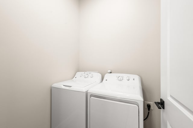 laundry room with washing machine and dryer and laundry area