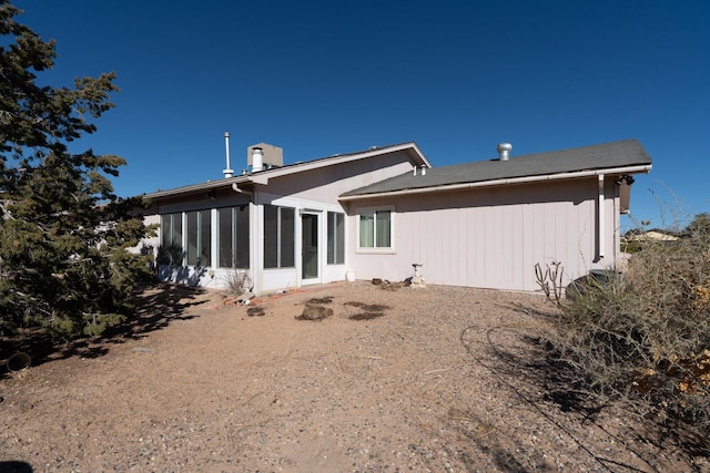 back of property featuring a sunroom