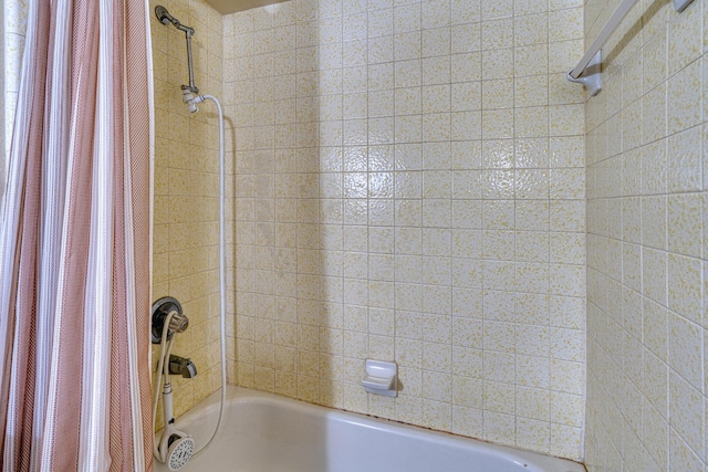 full bathroom with shower / tub combo with curtain