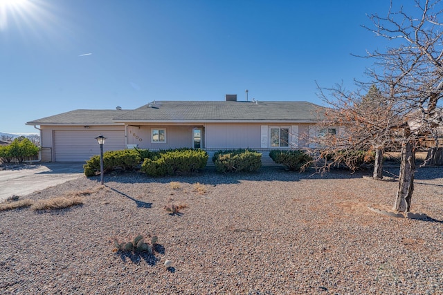 ranch-style home featuring an attached garage