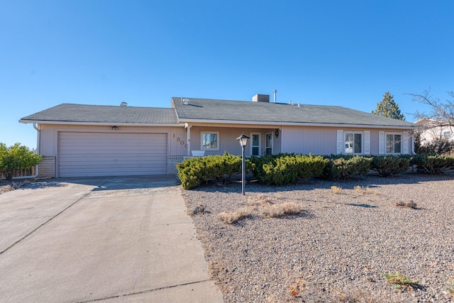 ranch-style house with concrete driveway, brick siding, and an attached garage