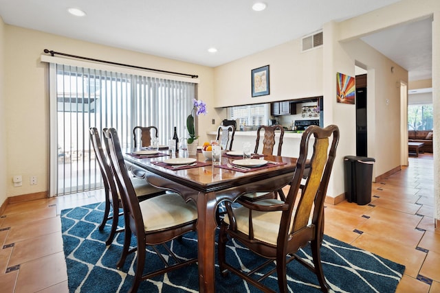 tiled dining room featuring recessed lighting, visible vents, and baseboards