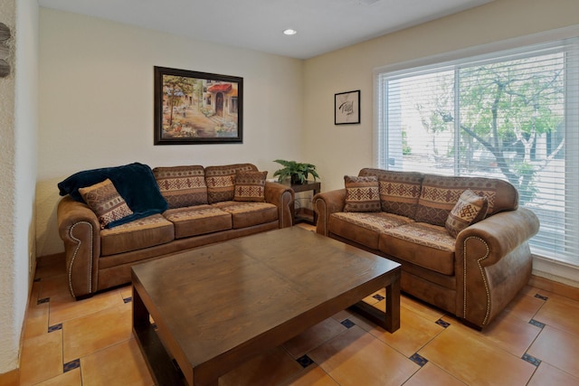 living room featuring light tile patterned flooring and recessed lighting